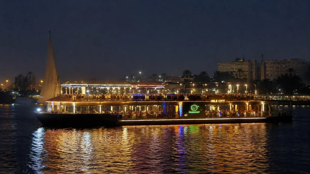 Nile City dinner cruise boat lit up at night in Cairo.