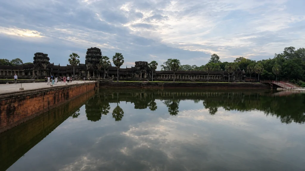 Angkor Wat reflected in the moat under an overcast sky, Siem Reap, Cambodia