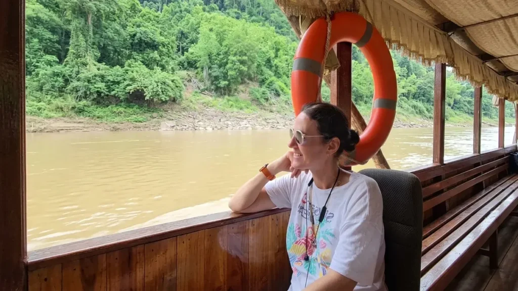 Slow boat arriving in Luang Prabang at sunset on the Mekong River