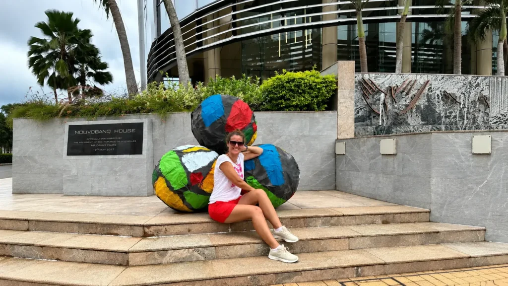 Colorful painted globe sculptures outside Nouvobanq House in Victoria, Seychelles