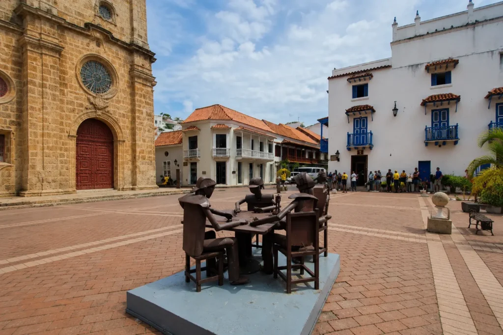 Edgardo Carmona iron sculpture of men at a table in Cartagena's Plaza San Pedro Claver