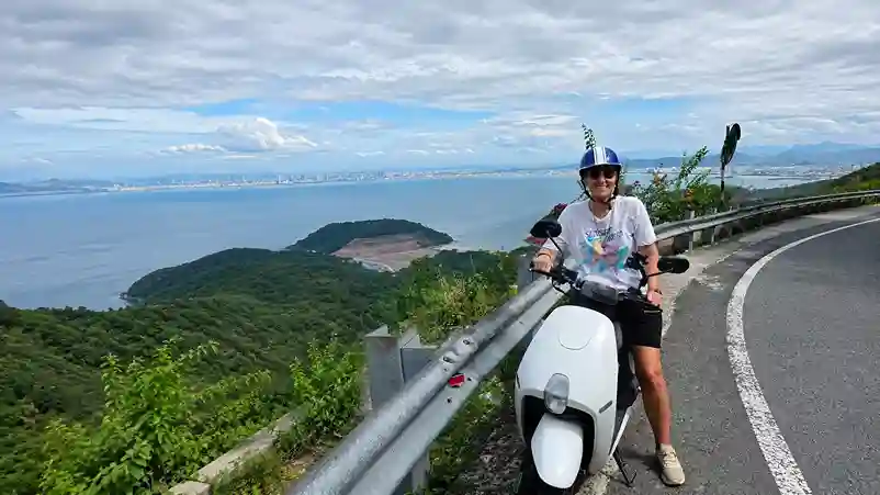 Scooter stop with coastal view on Hai Van Pass