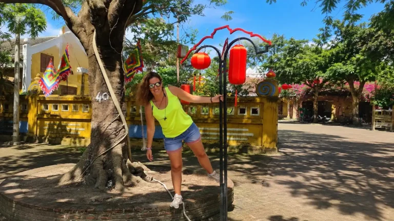 traveler posing by red lanterns in Hoi An Ancient Town
