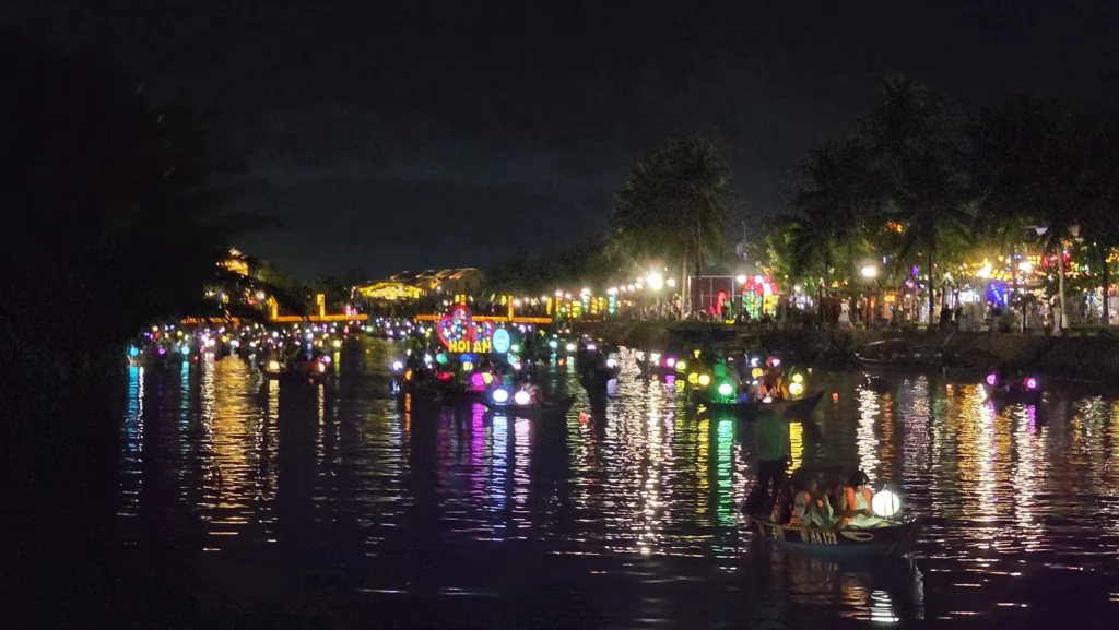 hundreds of floating lanterns lighting up the Hoai River in Hoi An at night
