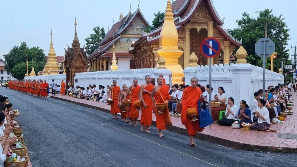 Monks collecting alms at dawn in Luang Prabang, Laos