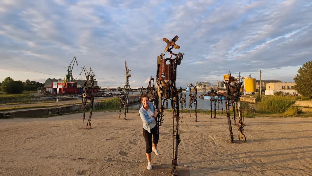 Rusted scrap-metal stilt sculptures on the former Gdańsk Shipyard slipway