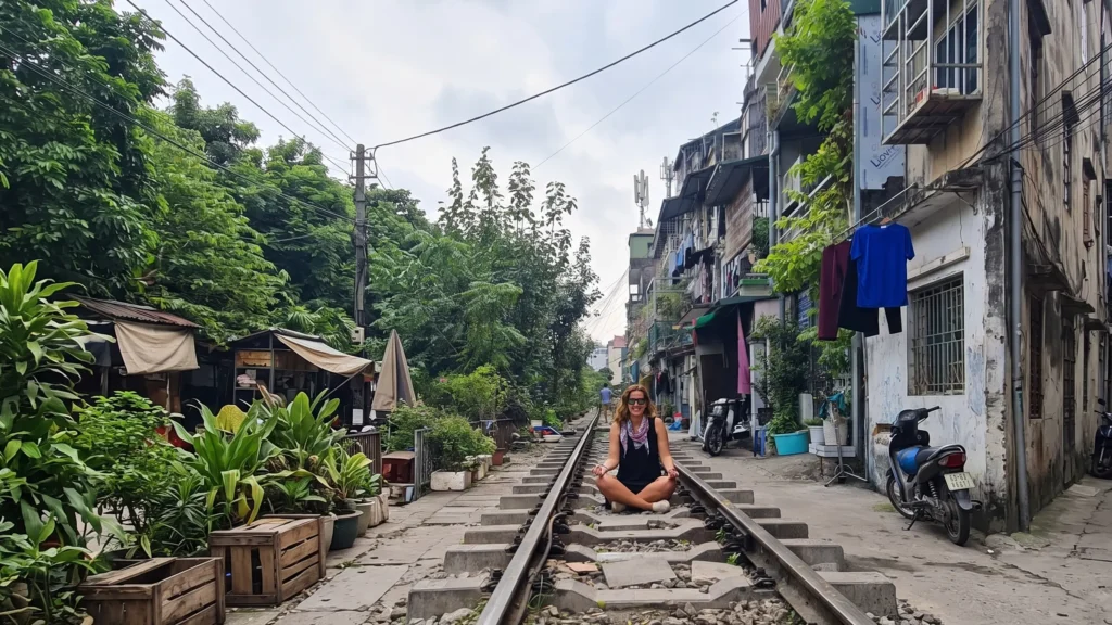 Sitting on Hanoi Train Street tracks in the Old Quarter