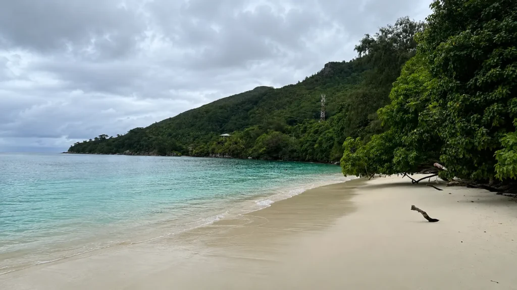 Turquoise water and white sand beach near Port Launay, Mahé, Seychelles