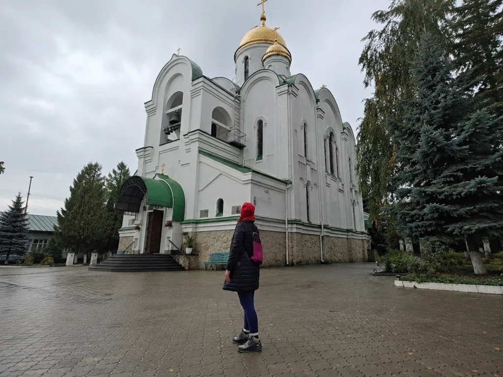 Cathedral of the Holy Virgin in Tiraspol featured in Transnistria travel guide—white walls, green trim, golden domes and crosses, recently renovated Orthodox church in unrecognized state