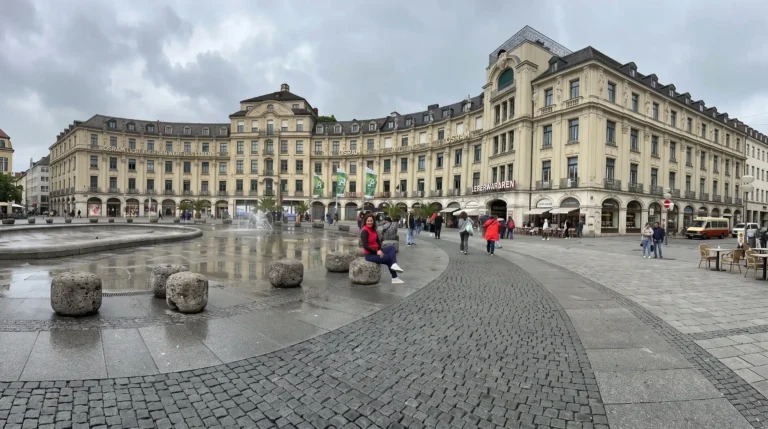 Marienplatz square with historic buildings and fountain, Munich travel guide