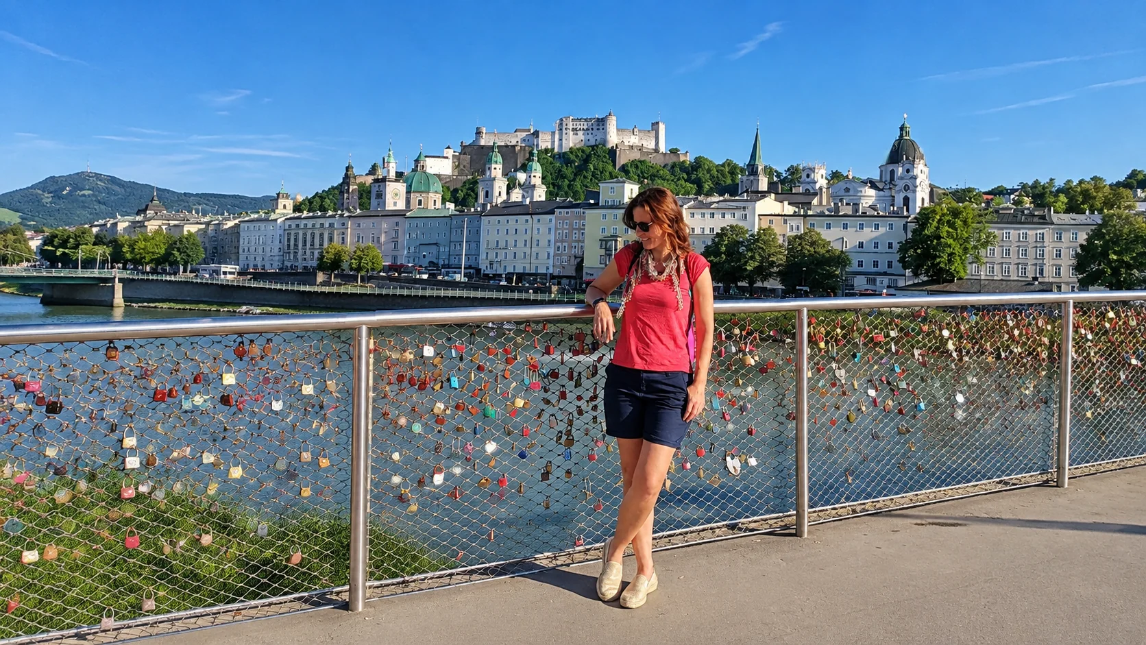 Salzburg travel guide cover with Hohensalzburg Fortress and the Old Town skyline seen from a love-lock bridge over the Salzach River