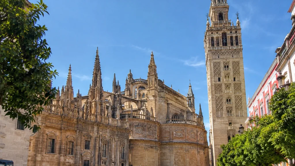 Seville Cathedral and the Giralda bell tower seen from Plaza Virgen de los Reyes.