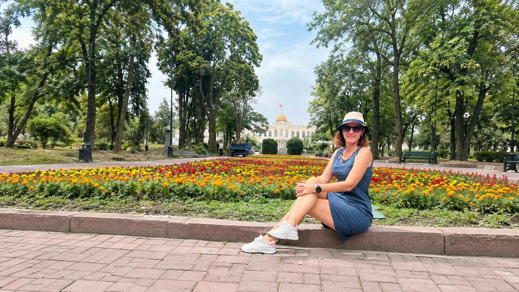 Bishkek travel guide cover: flower bed in a leafy park in central Bishkek, Kyrgyzstan