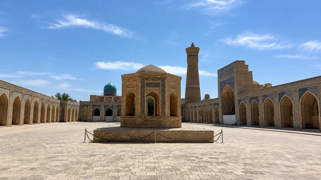 Kalon Mosque courtyard with the Kalon Minaret and a turquoise dome in Bukhara