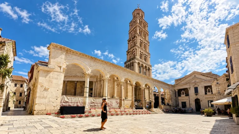 Split travel guide cover photo of a woman on the Peristyle square with the Cathedral of Saint Domnius bell tower in Diocletian's Palace